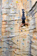 woman on rock wall