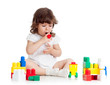 child girl playing with construction set