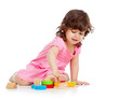 cute kid girl playing with colorful toys, isolated on white back