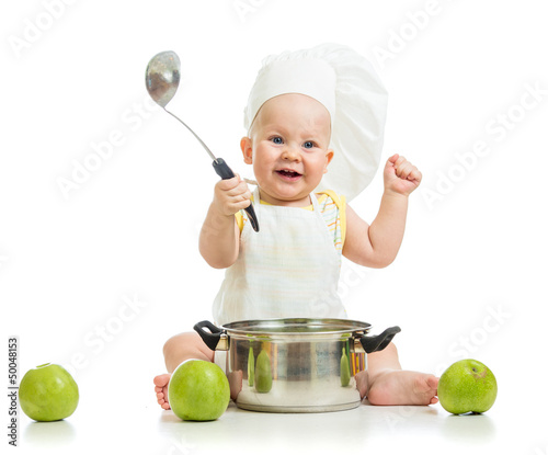 Photo: funny adorable baby with green apples isolated on white backgrou funny adorable baby with green apples isolated on white backgrou
