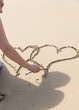 Foto: Senior lady draws intertwined hearts Senior lady draws intertwined hearts