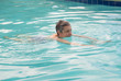 Foto: Senior lady swimming in pool Senior lady swimming in pool