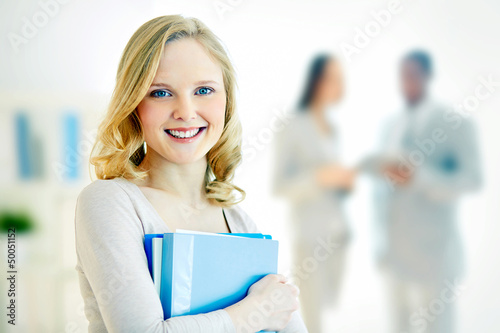 Photo: Female with papers Female with papers