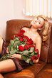 Young beautiful blonde woman with flowers