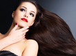 Beautiful woman with long brown straight hairs