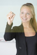 Young attractive businesswoman draw with digital pen