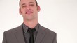 Successful businessman straightening his tie