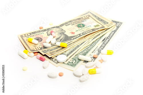Photo: american paper currency and medical pill as pay medicine american paper currency and medical pill as pay medicine