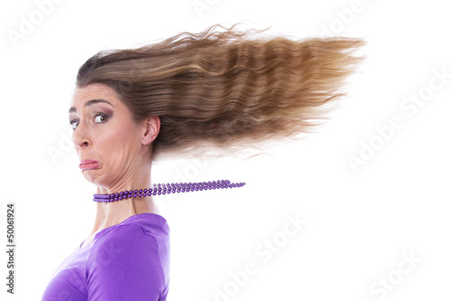 Photo: Trauriges Mädchen mit wehenden Haaren isoliert in Lila Trauriges Mädchen mit wehenden Haaren isoliert in Lila