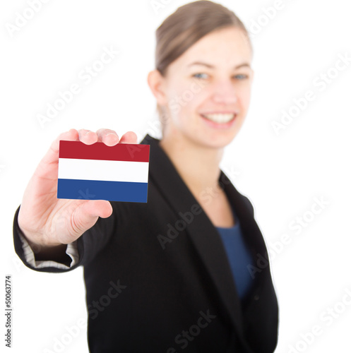 Photo: business woman holding a card with the Dutch flag business woman holding a card with the Dutch flag