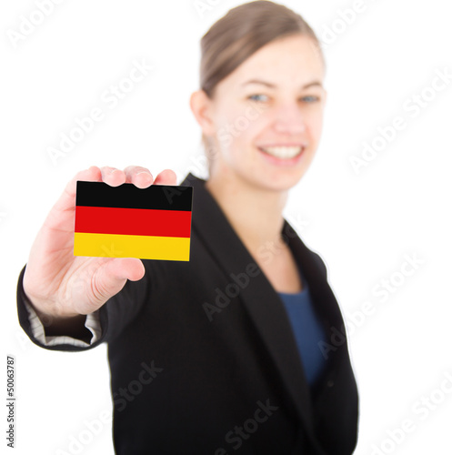 Photo: business woman holding a card with the German flag business woman holding a card with the German flag