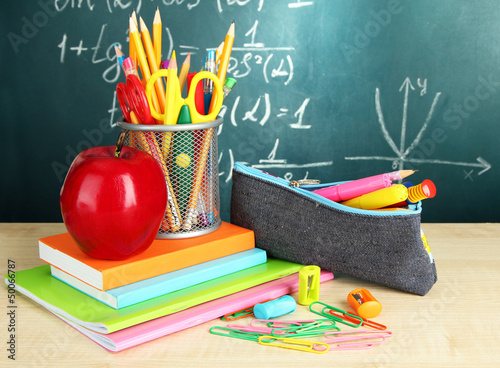 Photo: Back to school - blackboard with pencil-box and school Back to school - blackboard with pencil-box and school