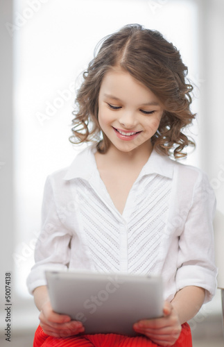 Photo: girl with tablet pc girl with tablet pc