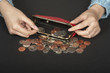 Woman's hand handling money in a purse
