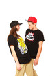 Couple of young man and woman hip-hop dancers posing on white ba