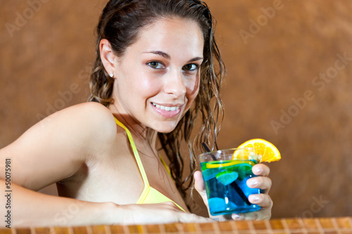 Photo: Woman relaxing in a spa with a cocktail Woman relaxing in a spa with a cocktail