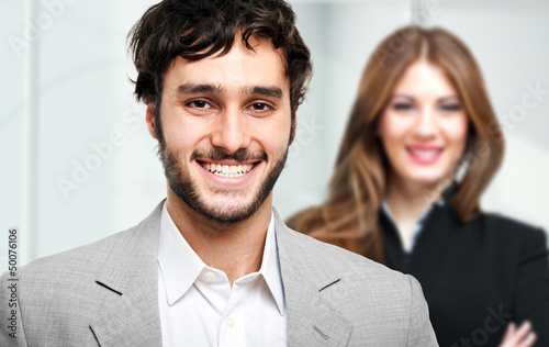 Photo: Couple of young businesspeople Couple of young businesspeople