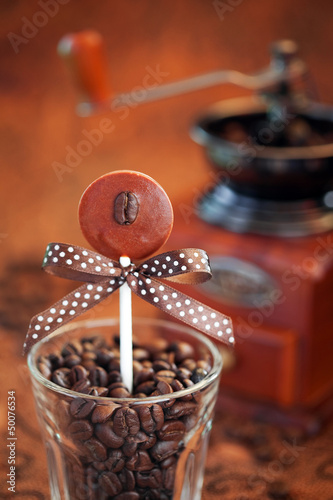 Photo: Chocolate coffee flavored lollipops, selective focus Chocolate coffee flavored lollipops, selective focus