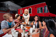Friends Talking and Dining on Pizza