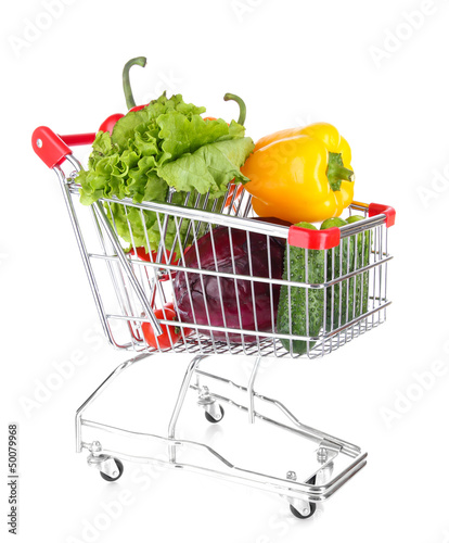 Photo: Fresh vegetables in trolley isolated on white Fresh vegetables in trolley isolated on white