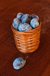 Plum on table and a punnet
