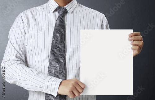 Photo: handing a blank business card over handing a blank business card over