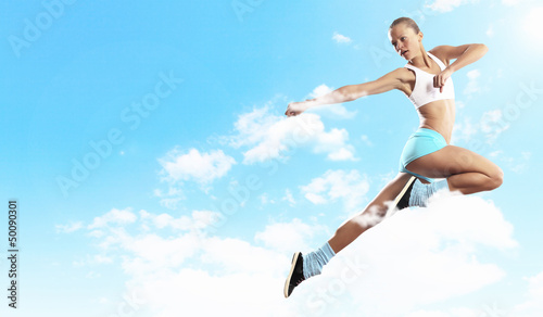 Photo: Image of sport woman jumping Image of sport woman jumping