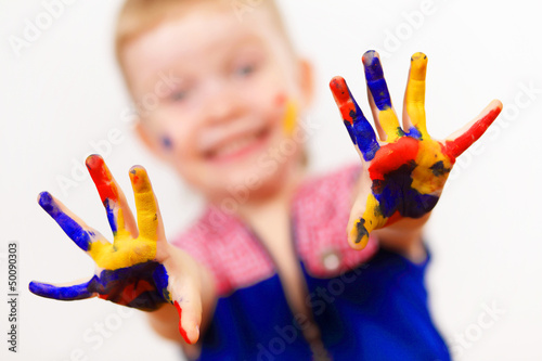 Photo: happy child with paint on the hands happy child with paint on the hands