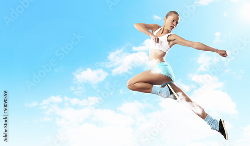 Photo: Image of sport woman jumping Image of sport woman jumping