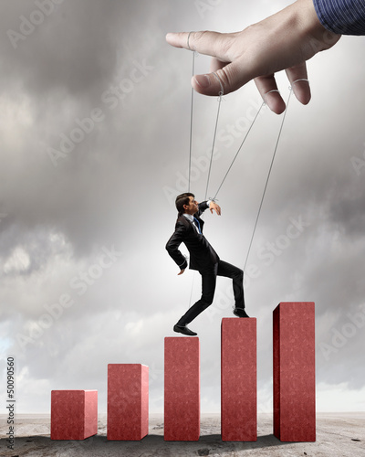 Photo: Business man marionette Business man marionette