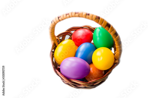Photo: colorful Easter eggs in bascket on white background colorful Easter eggs in bascket on white background