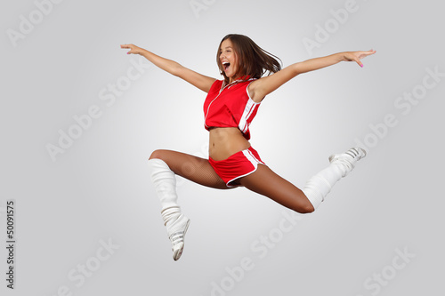 Photo: Young female dancer against white background Young female dancer against white background