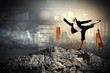 businesswoman standing atop of mountain
