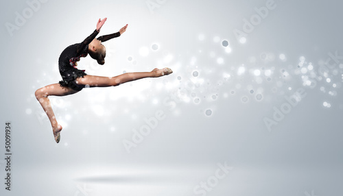 Photo: Young woman in gymnast suit posing Young woman in gymnast suit posing
