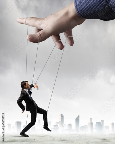 Photo: Business man marionette Business man marionette