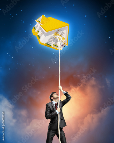 Photo: Image of businessman climbing rope Image of businessman climbing rope