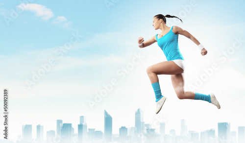Photo: Image of sport woman jumping Image of sport woman jumping