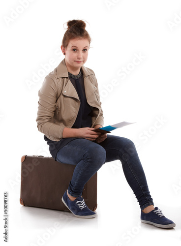 Photo: young girl with suitcase on white young girl with suitcase on white