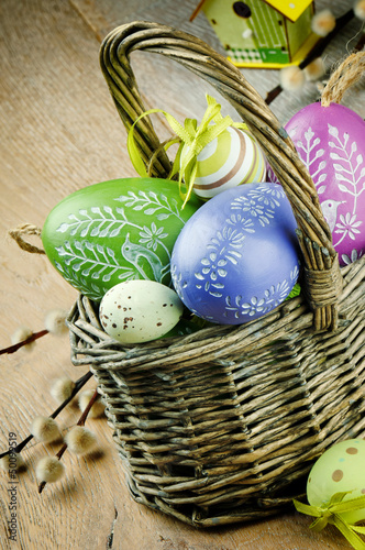 Photo: Basket with colorful Easter eggs Basket with colorful Easter eggs