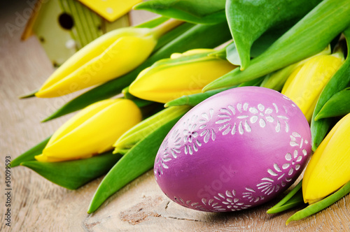 Photo: Easter setting with yellow tulips Easter setting with yellow tulips