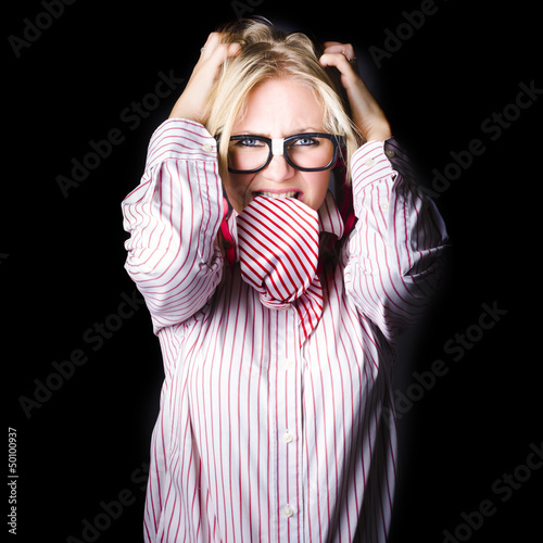 Photo: Mad and angry businesswoman pulling out hair Mad and angry businesswoman pulling out hair