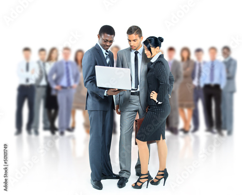 Photo: Happy business man holding a modern laptop computer Happy business man holding a modern laptop computer