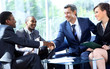 Business people shaking hands at a meeting