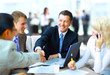 Business people shaking hands, finishing up a meeting