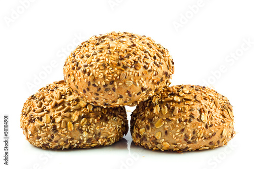 Photo: round wholemeal bread. resh buns with different seeds. round wholemeal bread. resh buns with different seeds.