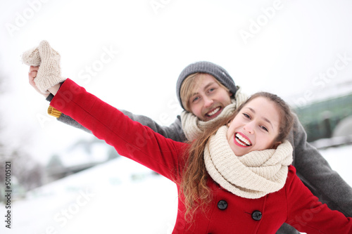 Photo: Couple having fun on winter day Couple having fun on winter day