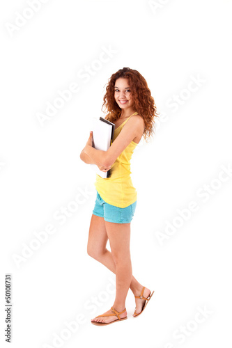 Photo: College girl holding books and smiling College girl holding books and smiling
