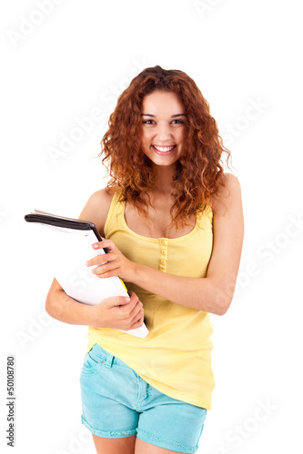 Photo: College girl holding books and smiling College girl holding books and smiling