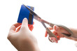 Foto: cutting up credit card with scissors cutting up credit card with scissors