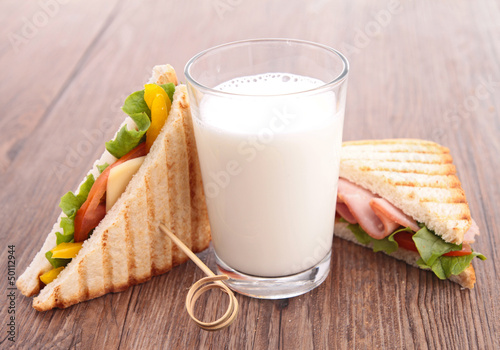 Photo: glass of milk and sandwich glass of milk and sandwich